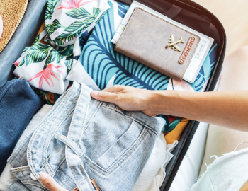 woman packing suitcase for vacation