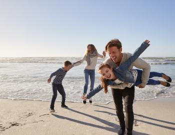 Family having fun on a calm beach